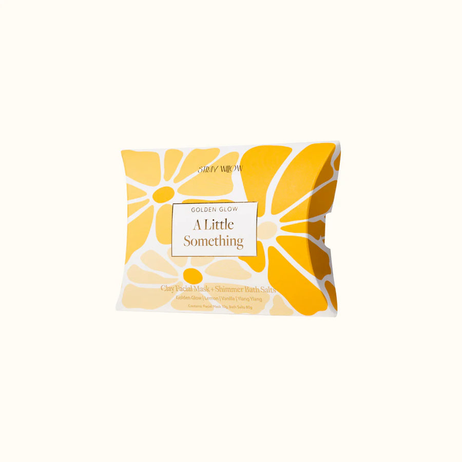 Yellow face mask packaging with decorative packaging on a white background