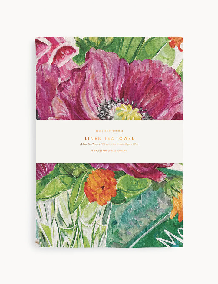 Floral design linen tea towel on a white background