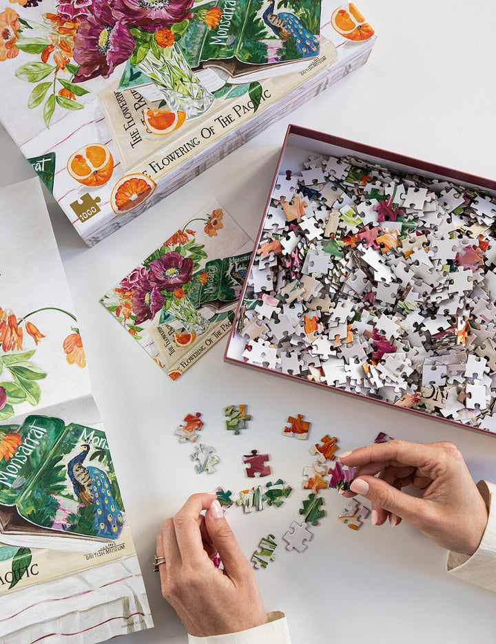 Floral-themed puzzle with pieces scattered on a table