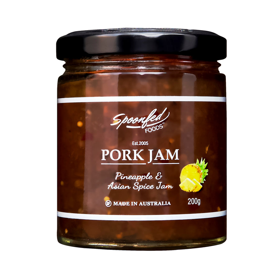 Jar of Spoonfed Foods Pork Jam with pineapple and Asian spice flavor on a white background