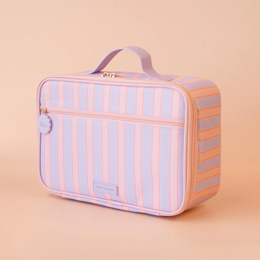Striped pink and purple lunch bag on a beige background
