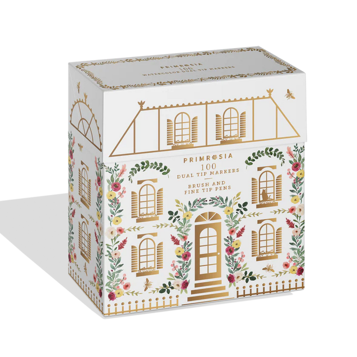 Decorative box of dual tip markers with architectural design and floral elements on a white background