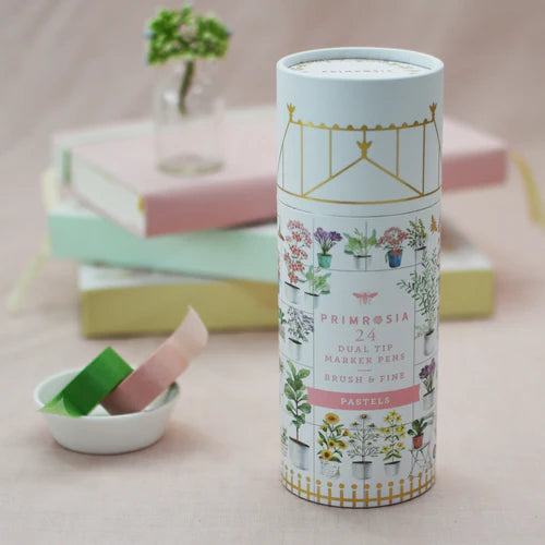 Tube of Primrosia dual-tip marker pens with plant illustrations on a light background