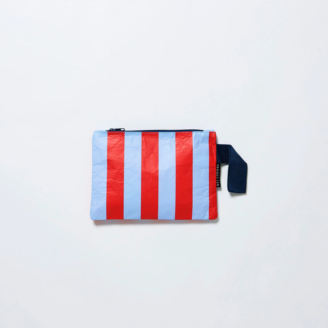 Striped pouch with red and blue vertical stripes on a light gray background