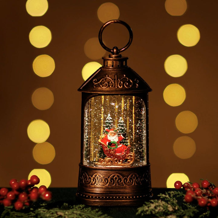 Decorative lantern with a Christmas scene inside, surrounded by festive decorations and lights.