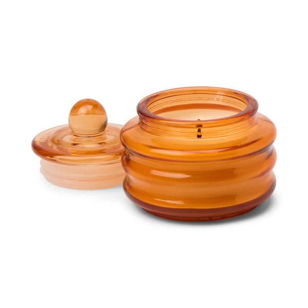 Amber glass jar with a lid on a white background
