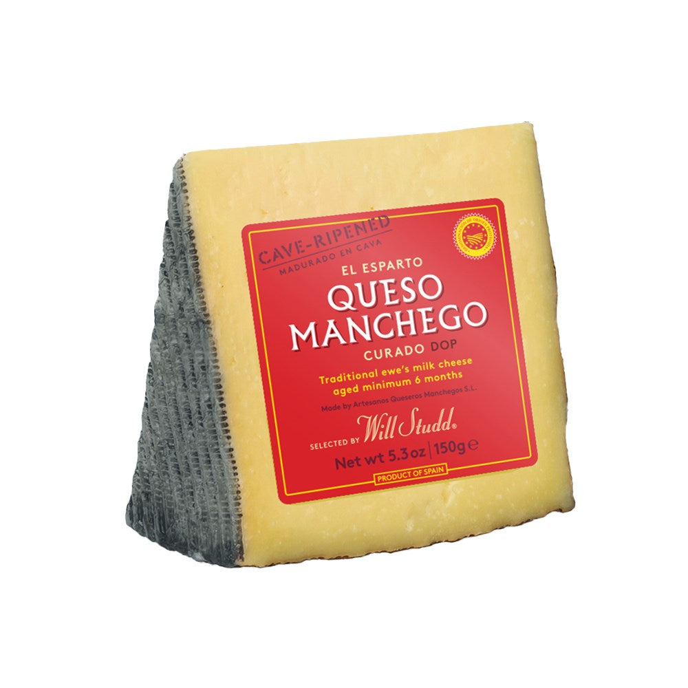 A wedge of manchego cheese with a red label on a white background