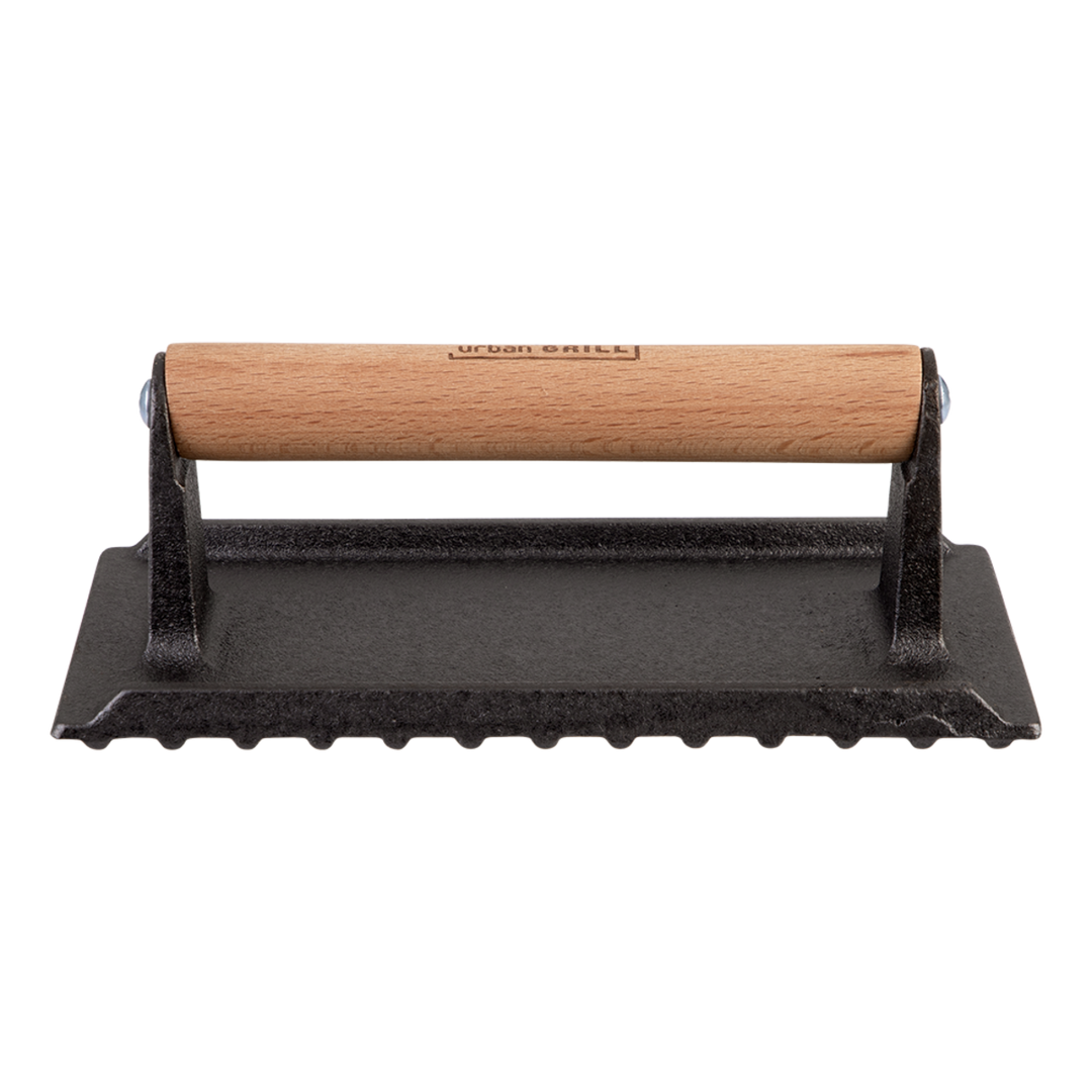 Black cast iron grill press with wooden handle on a white background