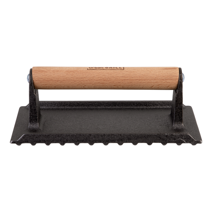 Black cast iron grill press with wooden handle on a white background