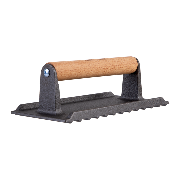 Cast iron grill press with wooden handle on a white background