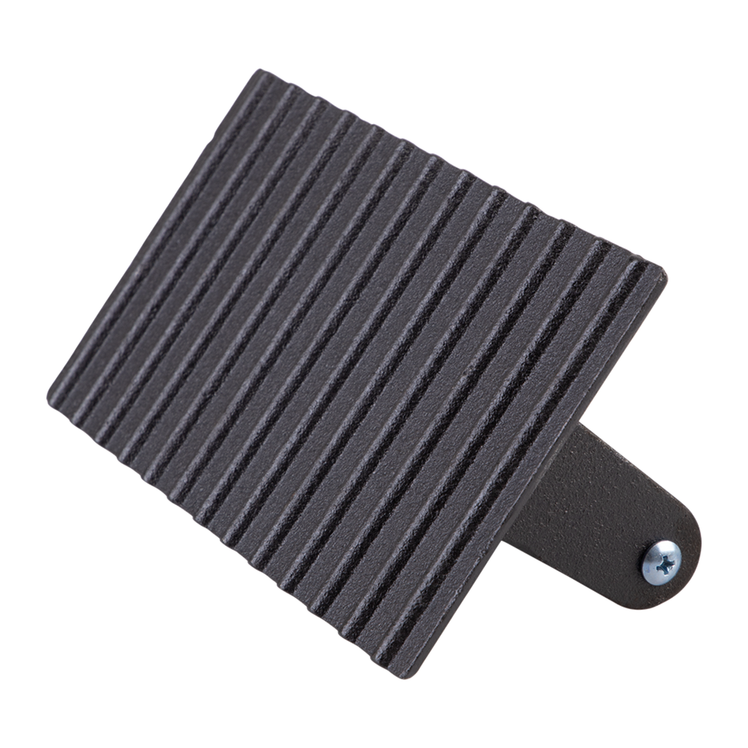 Cast iron grill press with a screw on a white background