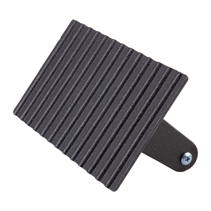 Cast iron grill press with a screw on a white background