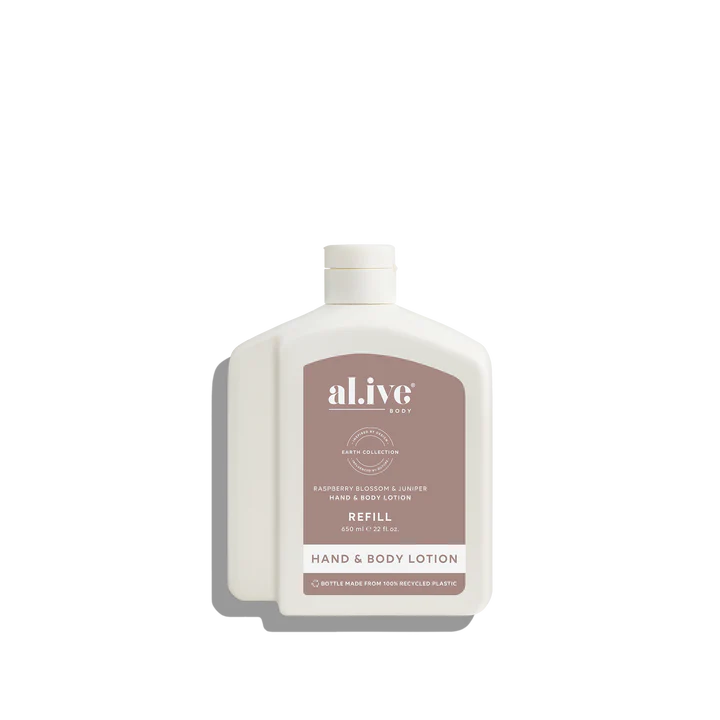 White bottle of al.ive hand and body lotion on a white background