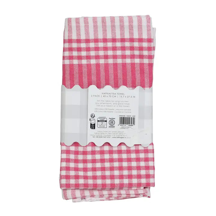 Pink and white checkered towel with packaging on a white background
