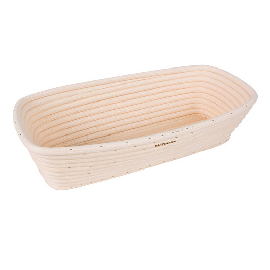Banneton bread proofing basket with a ribbed bottom on a white background