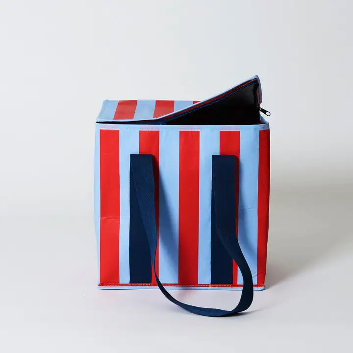 Striped tote bag with red, blue, and white vertical stripes on a light gray background