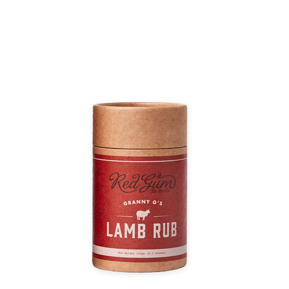 A packaged product labeled 'Red Gum GRANNY G'S LAMB RUB' in a cylindrical cardboard container with a red and white design.