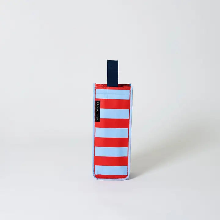 Red and blue striped bag with a black handle on a white background