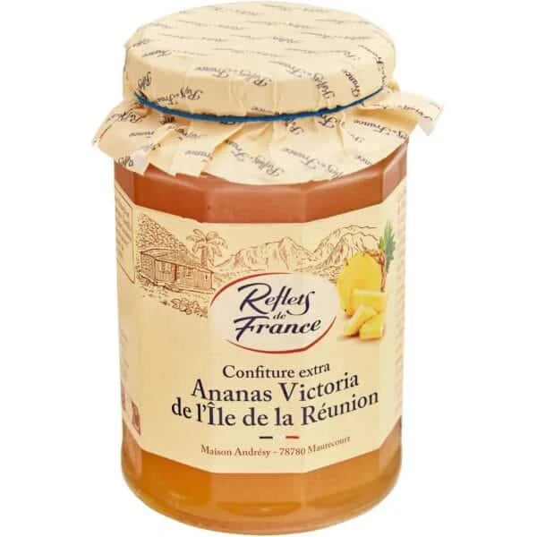 Jar of pineapple jam with 'Reflets de France' label on a white background