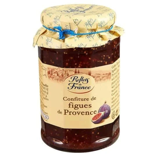 Jar of Reflets de France fig jam with a decorative label on a white background