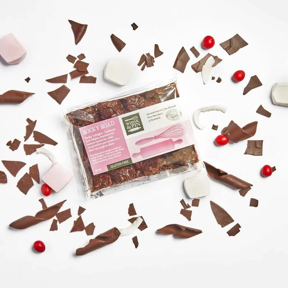 Packaged chocolate bars with decorative elements on a white background