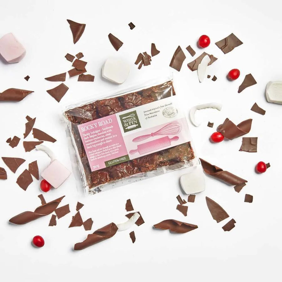 Packaged chocolate bars with decorative elements on a white background