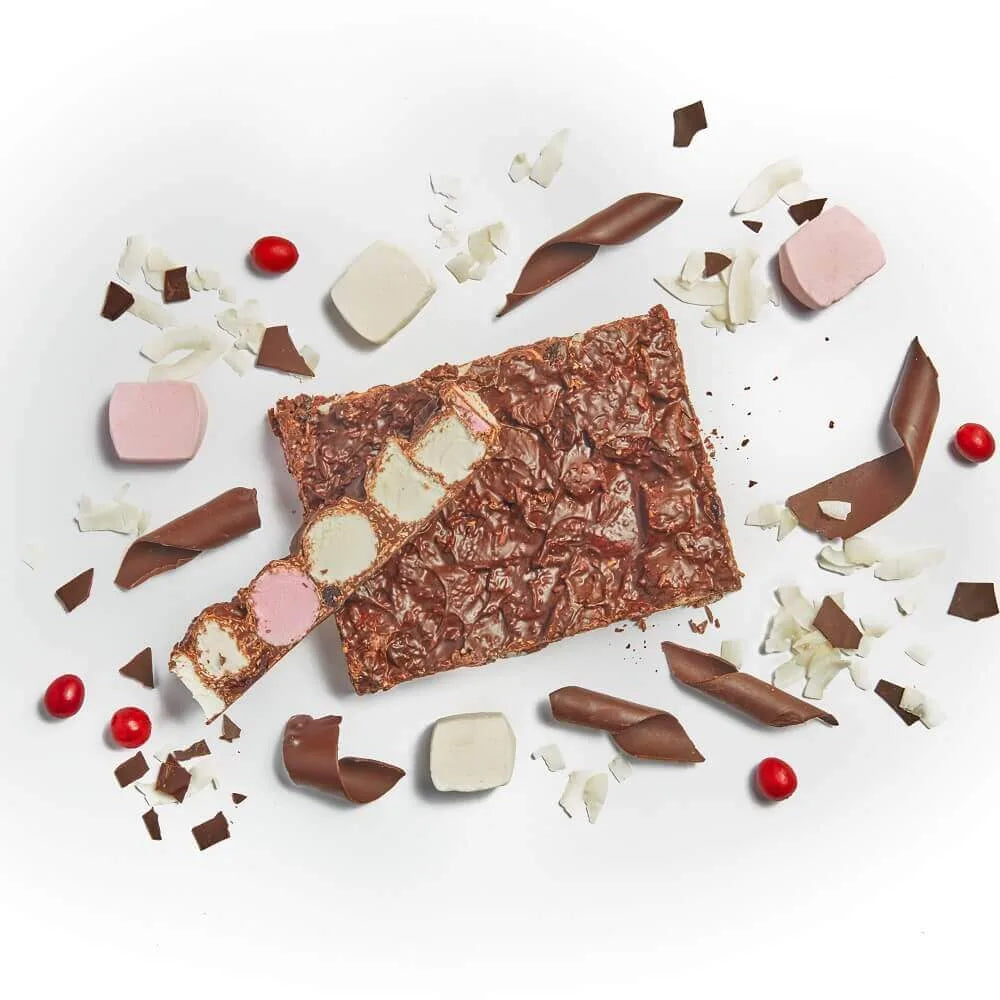 Chocolate bars with various toppings on a white background