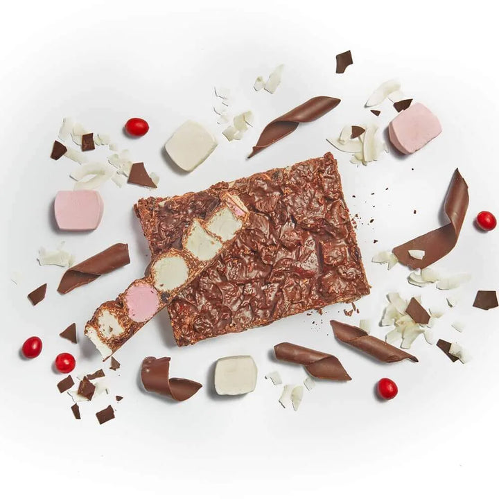Chocolate bars with various toppings on a white background