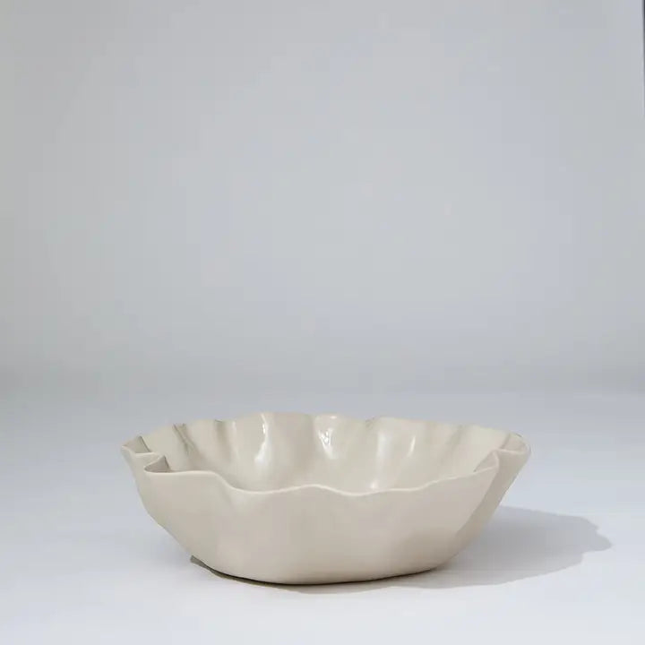Beige ceramic bowl on a white background