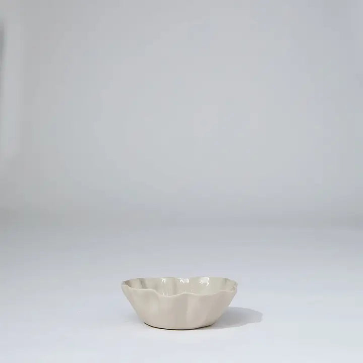 White ceramic bowl on a light gray background