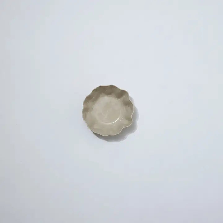 Small ceramic dish on a light gray background