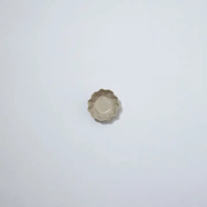 Small ceramic bowl on a light gray background