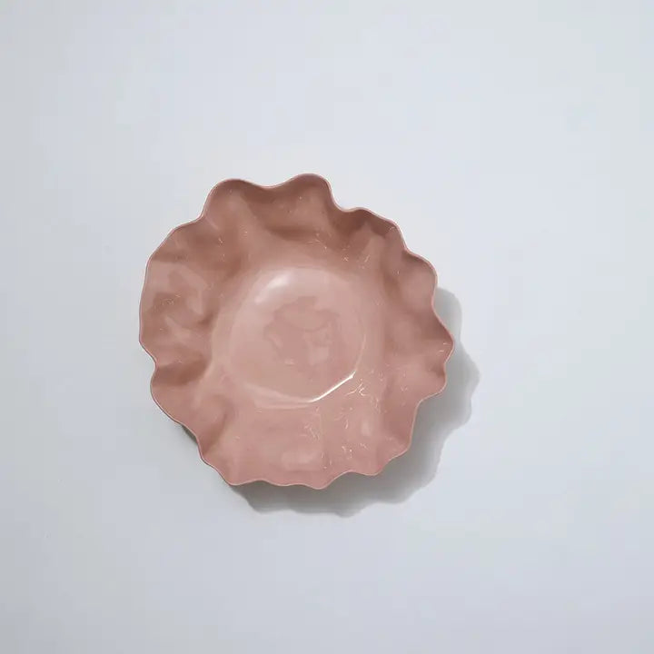 Pink ceramic pie dish on a light gray background