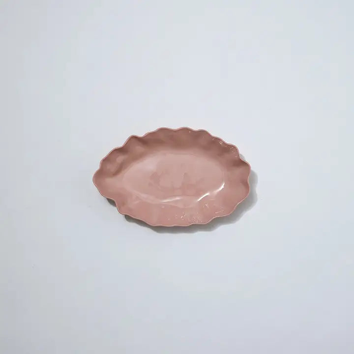 Pink ceramic plate on a light gray background