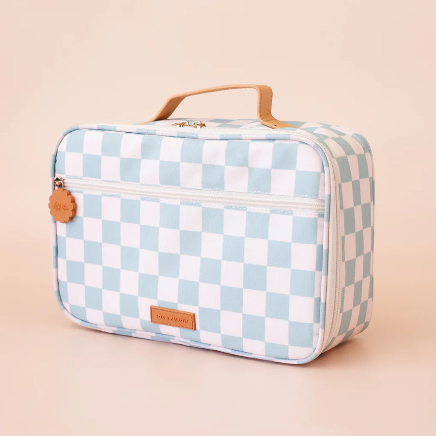 Checkered lunch bag with a handle on a beige background