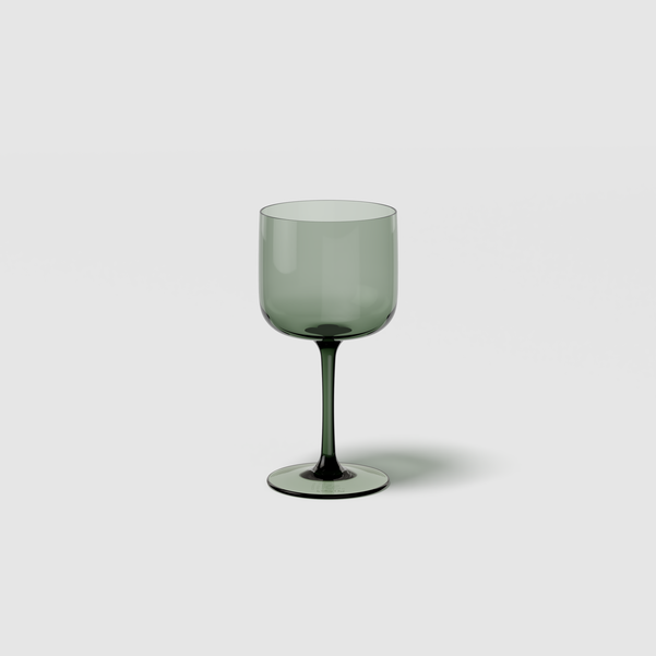 Green wine glass on a white background