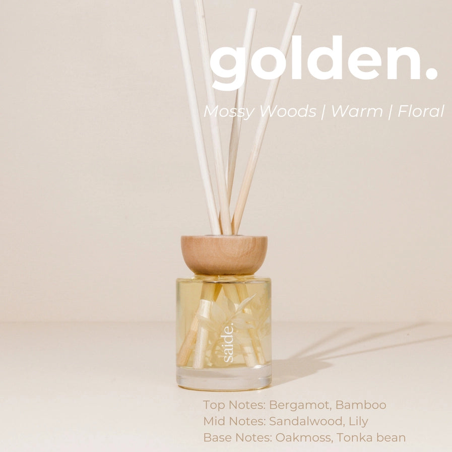 Reed diffuser with wooden base and glass container on a light background, featuring the brand 'sable'.