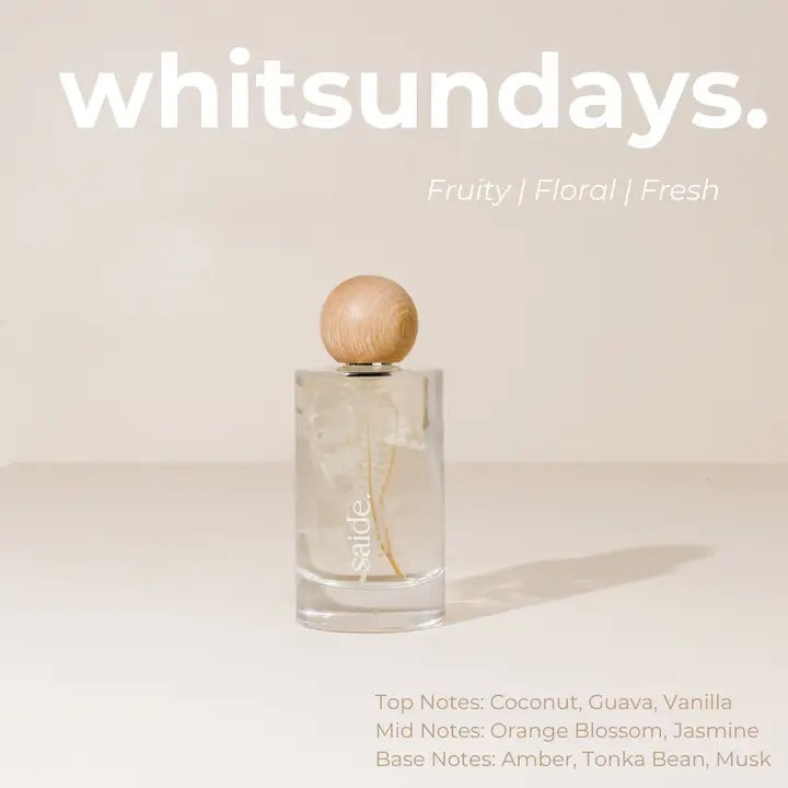 Interior fragrance bottle with wooden cap on a light background, featuring the brand 'whitsundays'.