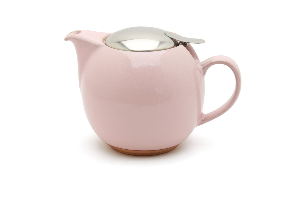 Pink teapot with a silver lid on a white background