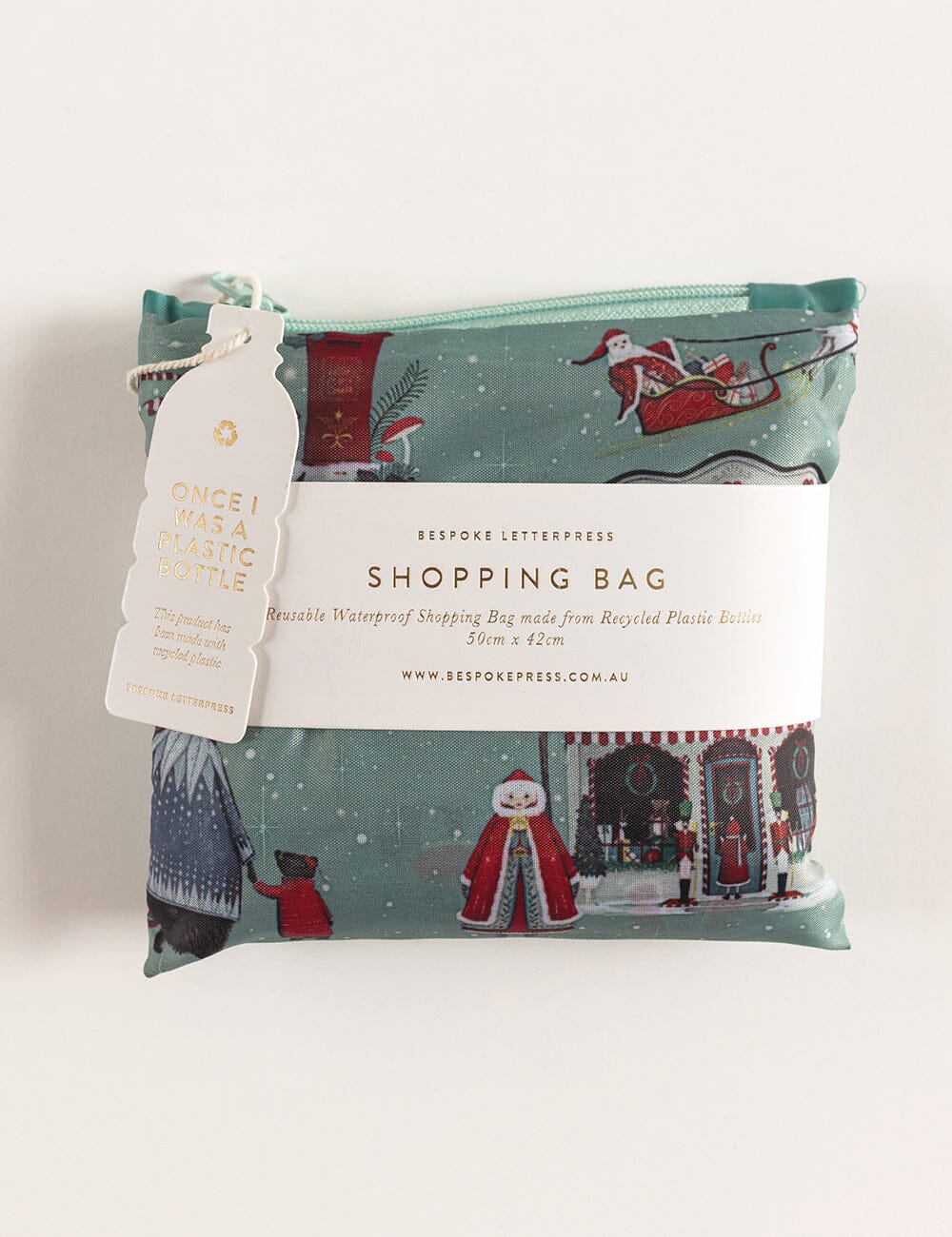 Christmas-themed shopping bag with a tag on a white background