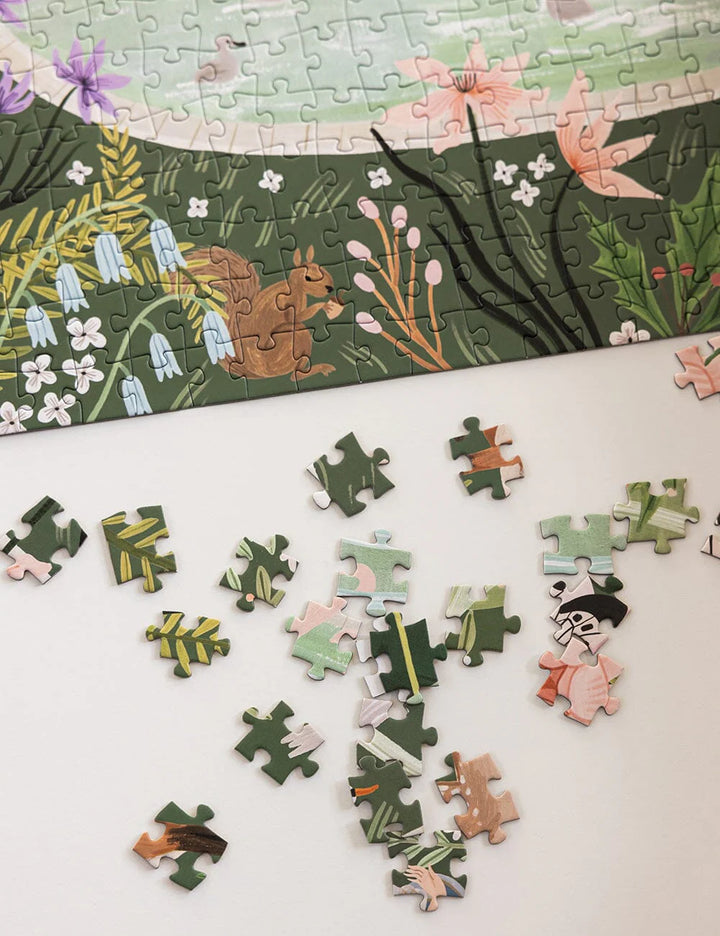 Jigsaw puzzle with completed pieces and missing ones on a white surface