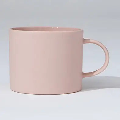 Pink mug on a light gray background