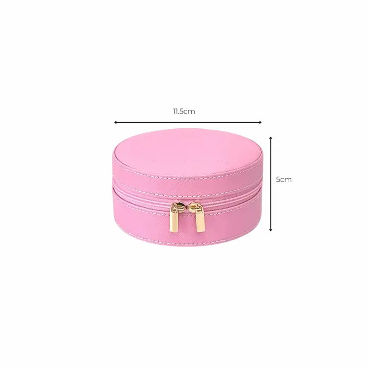 A pink faux-leather round jewelry box with a zippered top, shown with dimension lines indicating a width of 11.5cm and a height of 5cm.