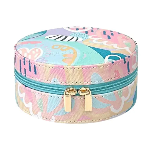 A round zippered jewelry box with a pastel multicolor abstract pattern, featuring a turquoise zipper and gold-tone dual pull tabs, set against a plain white background.