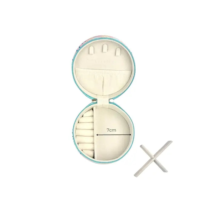 An open round jewelry organizer case with a light blue border and cream-colored interior compartments, shown on a white background with a small white cross-shaped accessory and a 7cm size marker.
