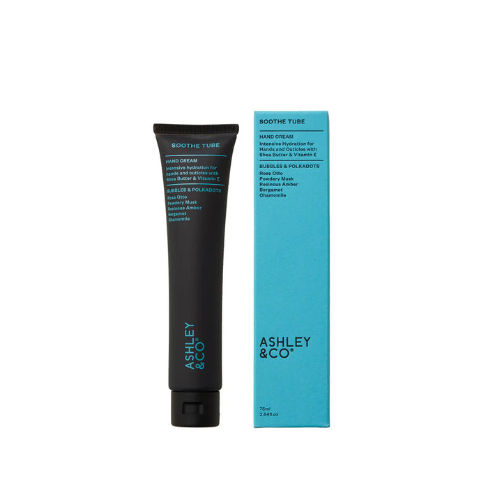 Black tube and blue box of Ashley &amp; Co hand cream on a white background