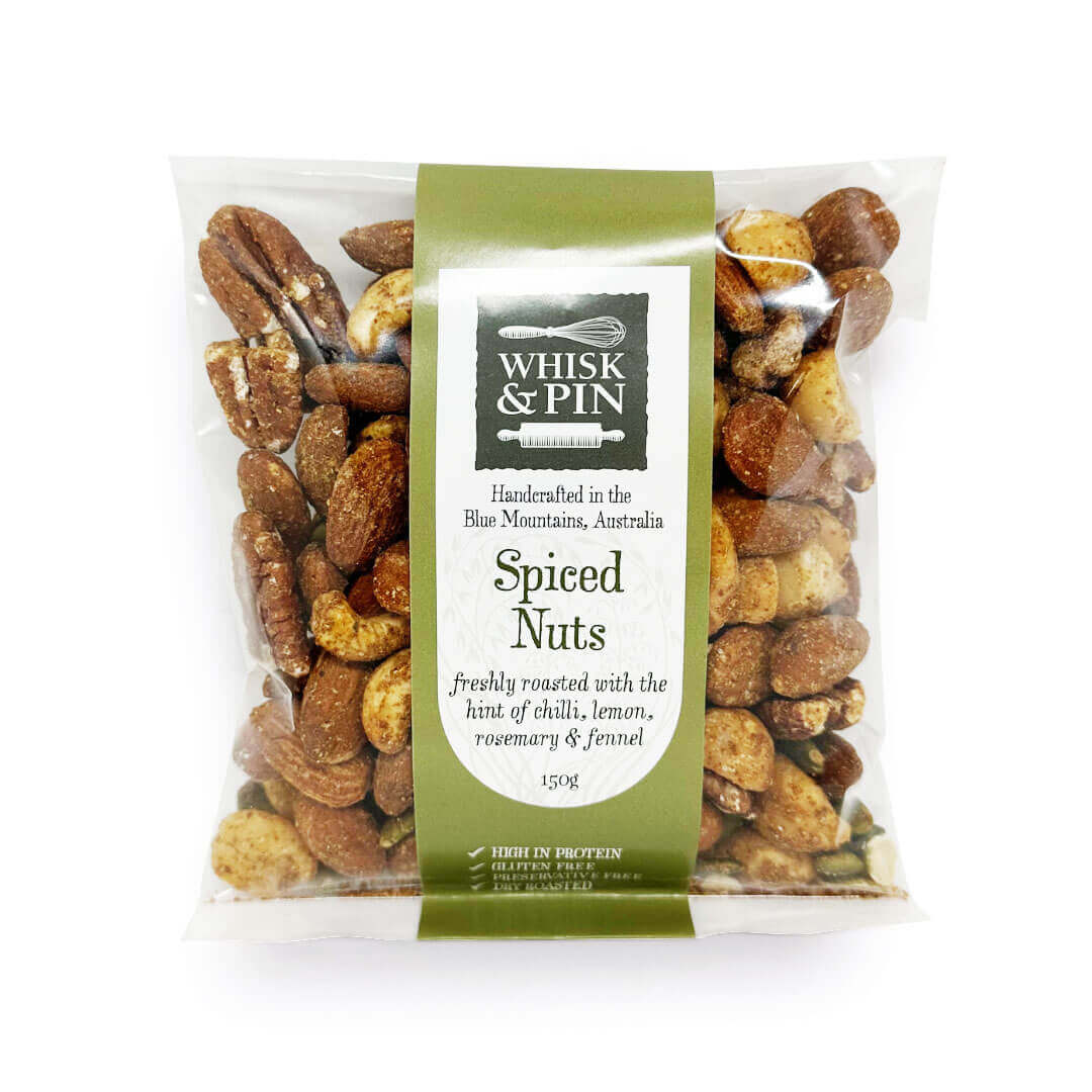 Packaged spiced nuts with Whisk &amp; Pin branding on a white background