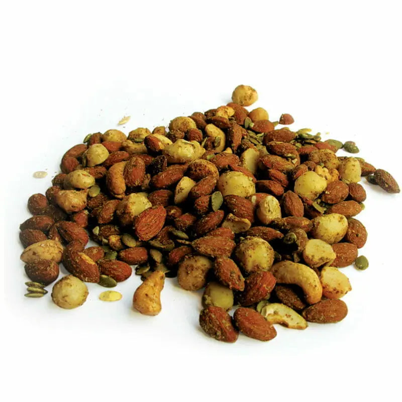Pile of mixed nuts on a white background