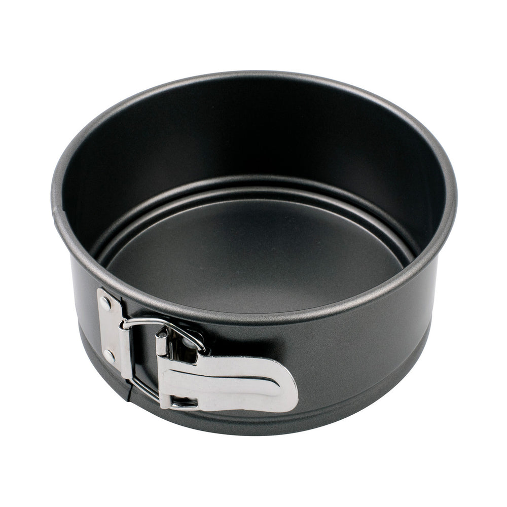 Black springform pan with a silver latch on a white background