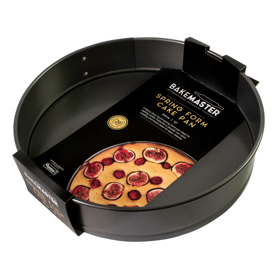 Bakemaster spring form cake pan with a cake on the packaging on a white background